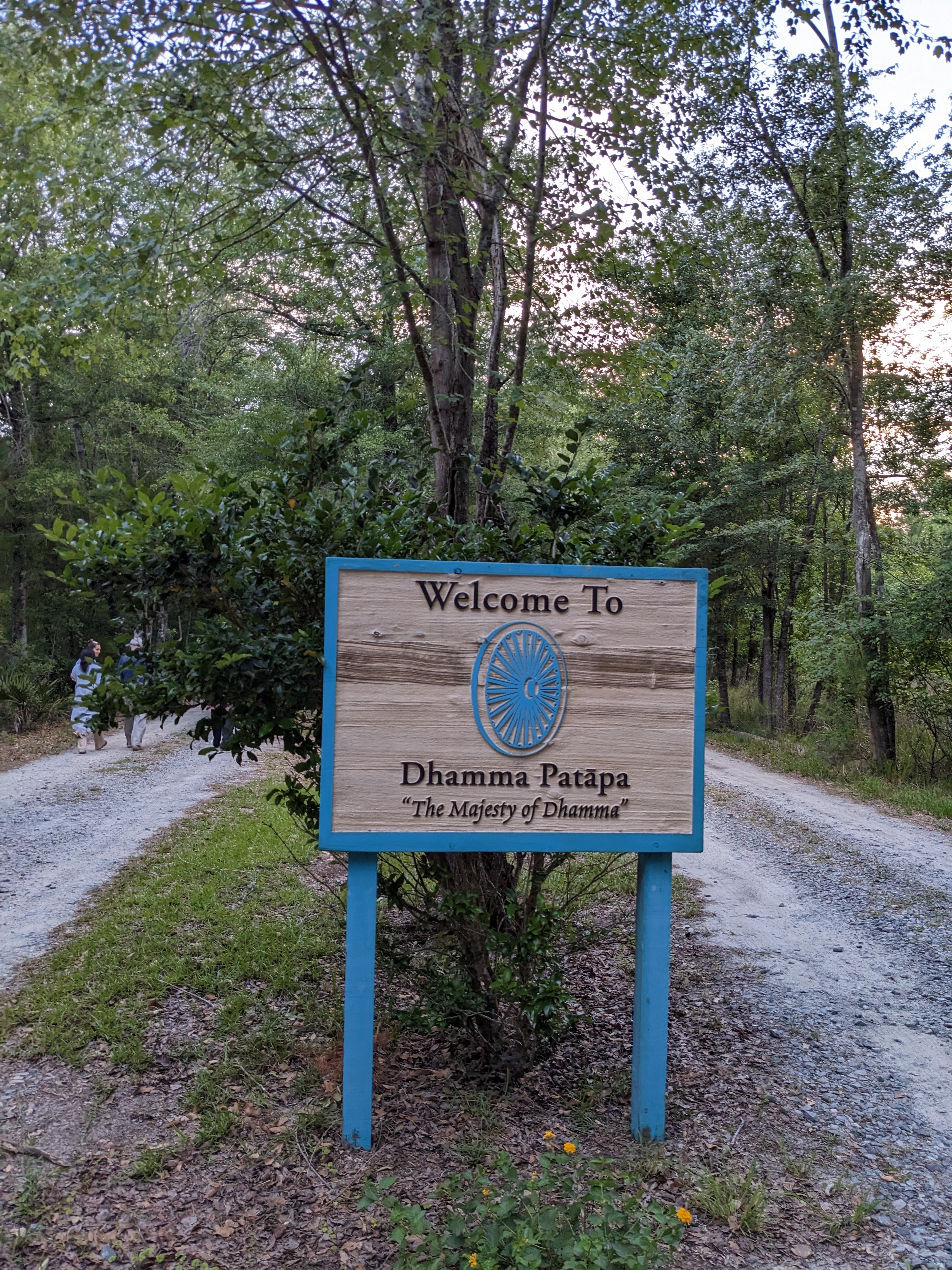 View of the grounds of the 10 day silent meditation course center. The sign reads “Welcome To Dhamma Patapa”